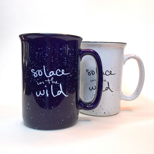 Solace in the Wild ceramic mugs in blue and white with retro speckle campfire style